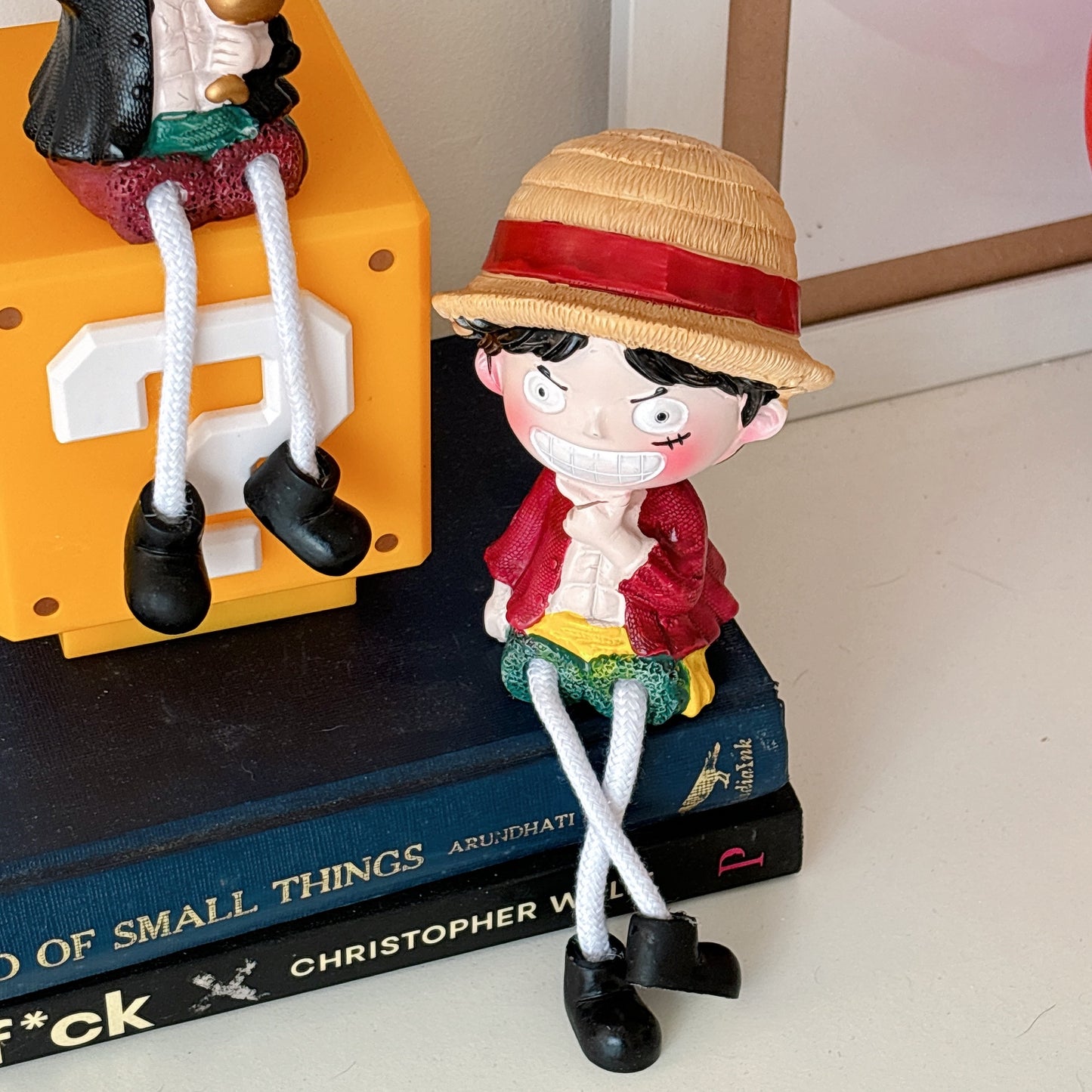 One piece hanging legs figurine