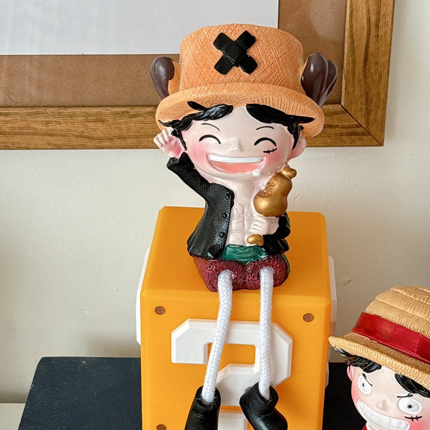 One piece hanging legs figurine