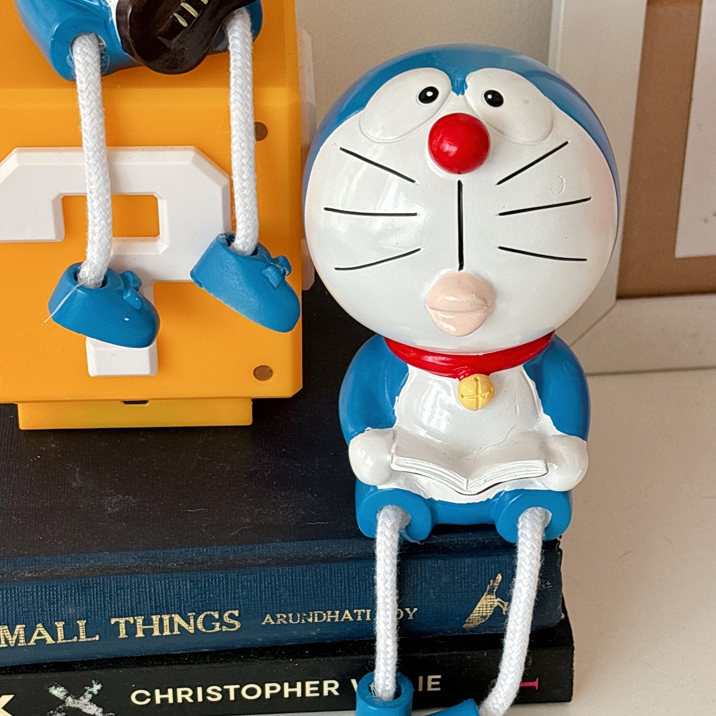 Doraemon hanging legs figurine